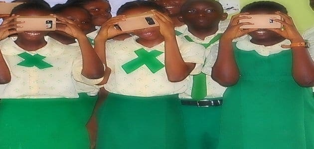 school children having a feel of virtual reality