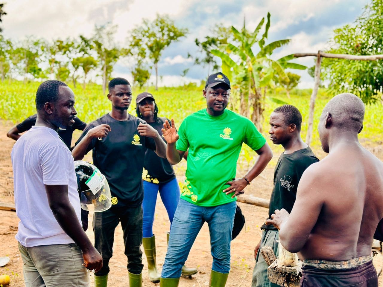 Edmond Kombat CEO of Oyster Agribusiness in green shirt interacting with some farmers 2 1